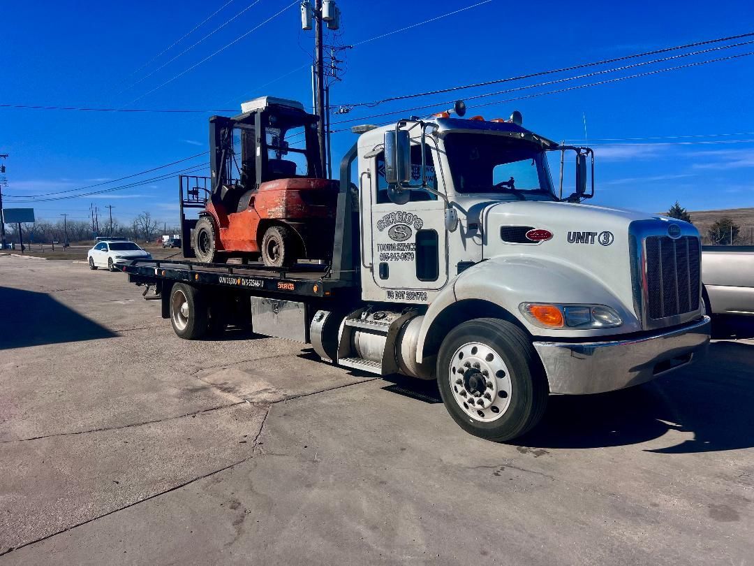 Man Checking The Truck — Oklahoma City, OK — Sergio’s Towing Service Man Checking The Truck — Oklahoma City, OK — Sergio’s Towing Service