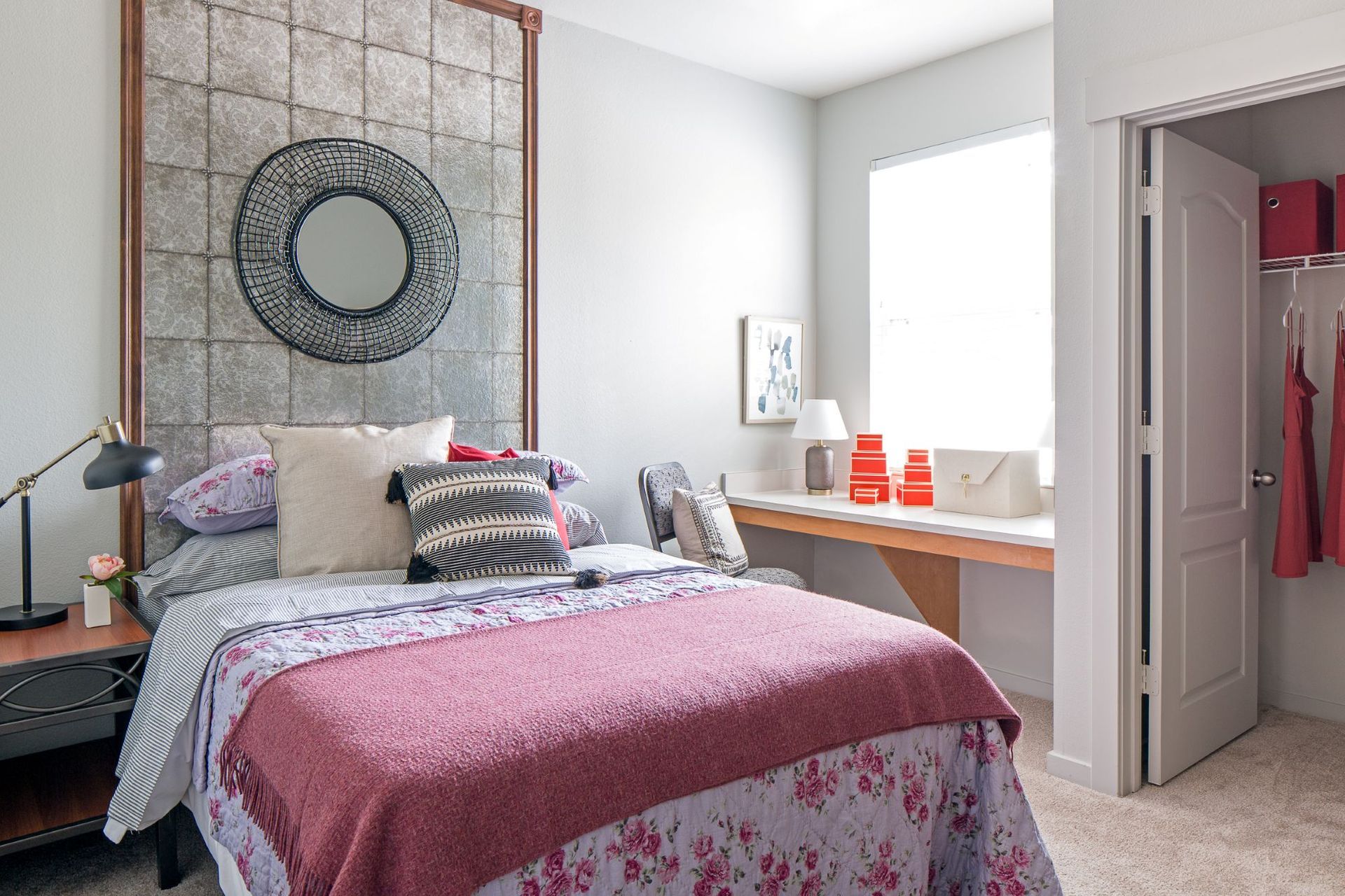 Bright, spacious bedroom with hardwood-style flooring and natural light at Hawks Ridge Apartments