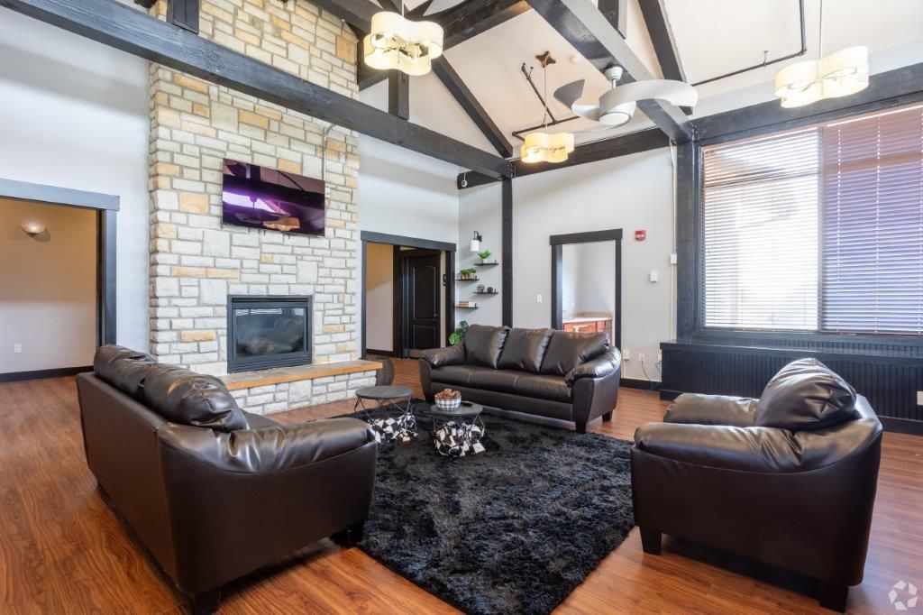 Cozy fireplace lounge in Iowa City off-campus housing