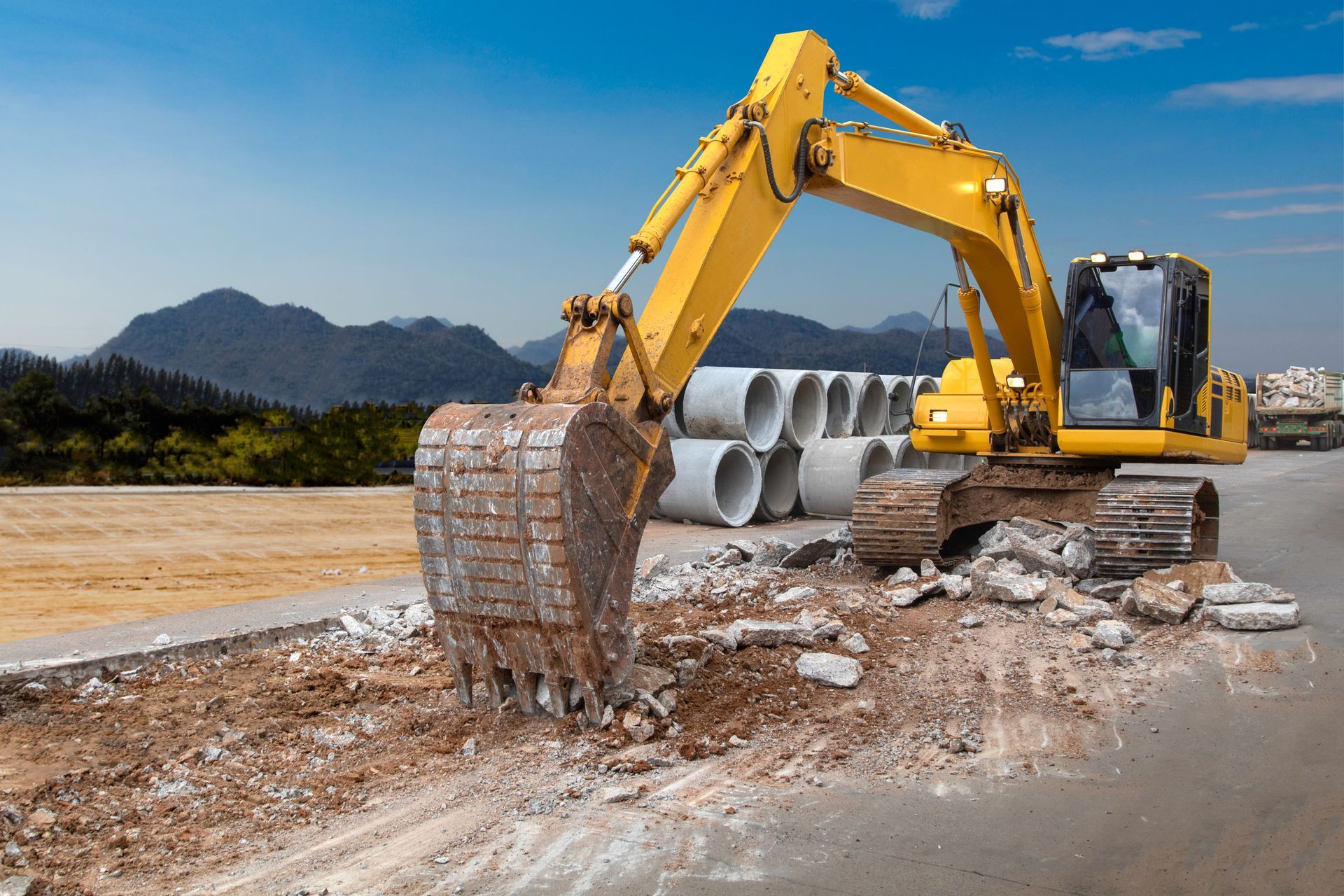 Excavator Demolishing Pavement Excavator Demolishing Pavement