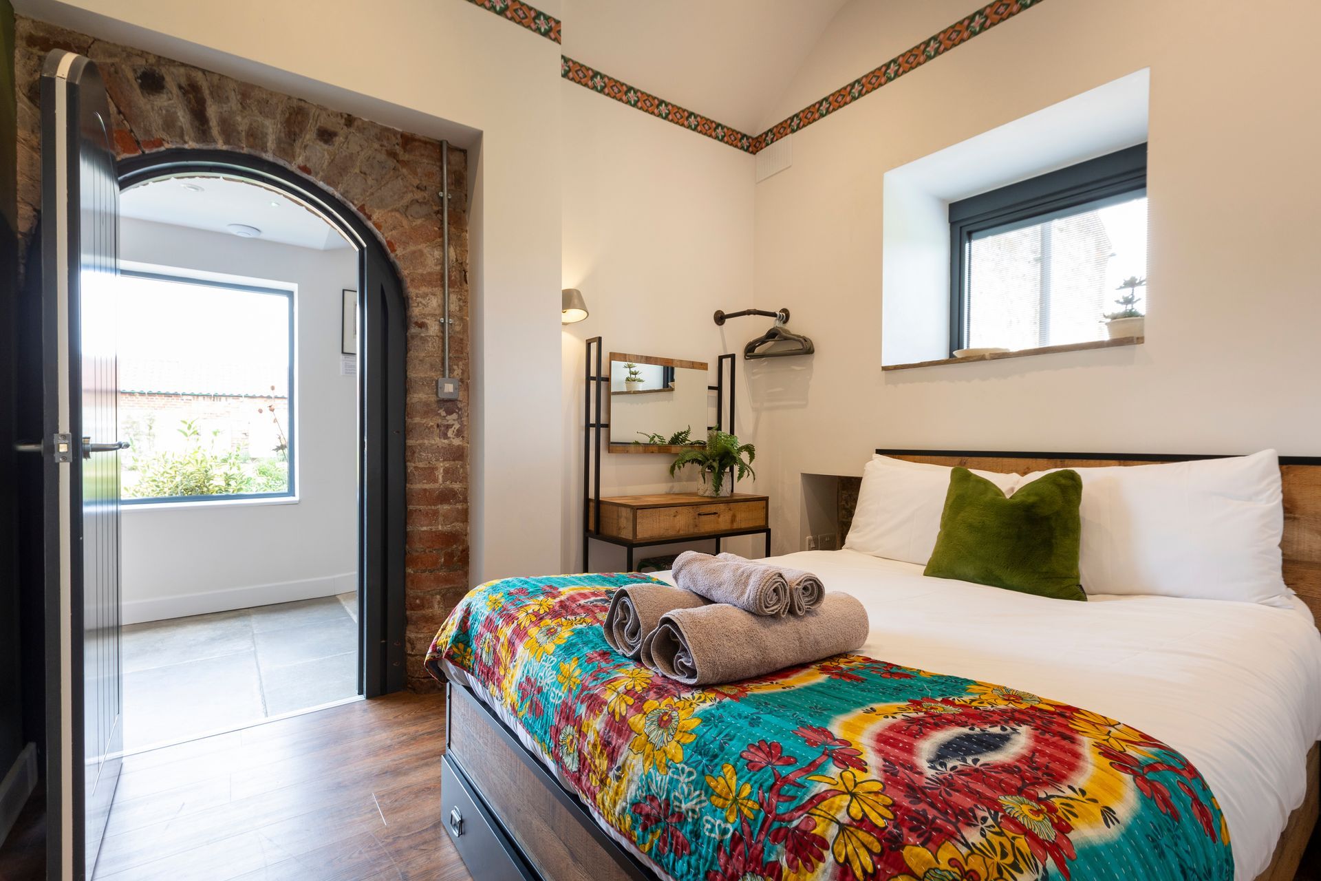 Bedroom with original arched door