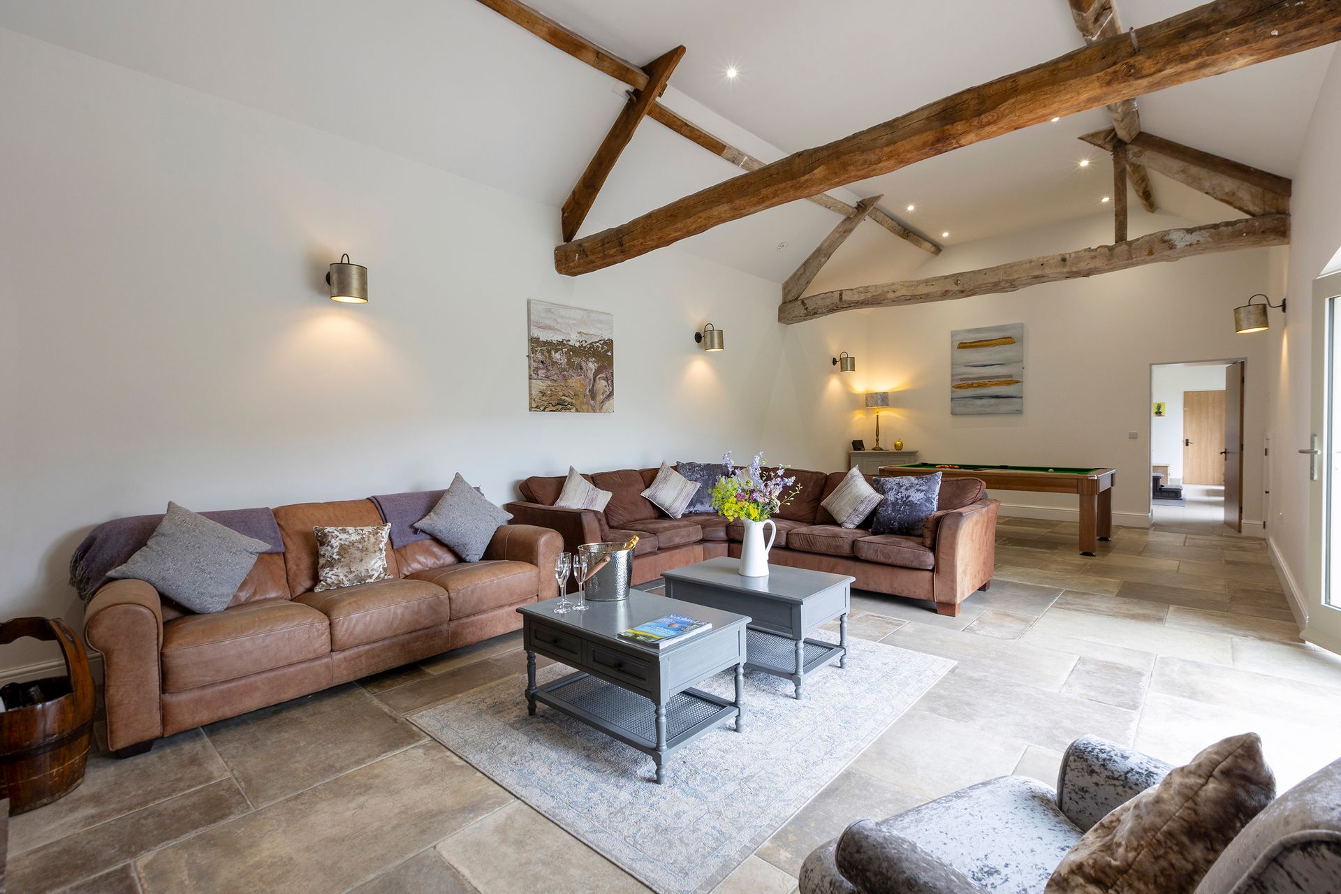 large seating area with vaulted ceiling