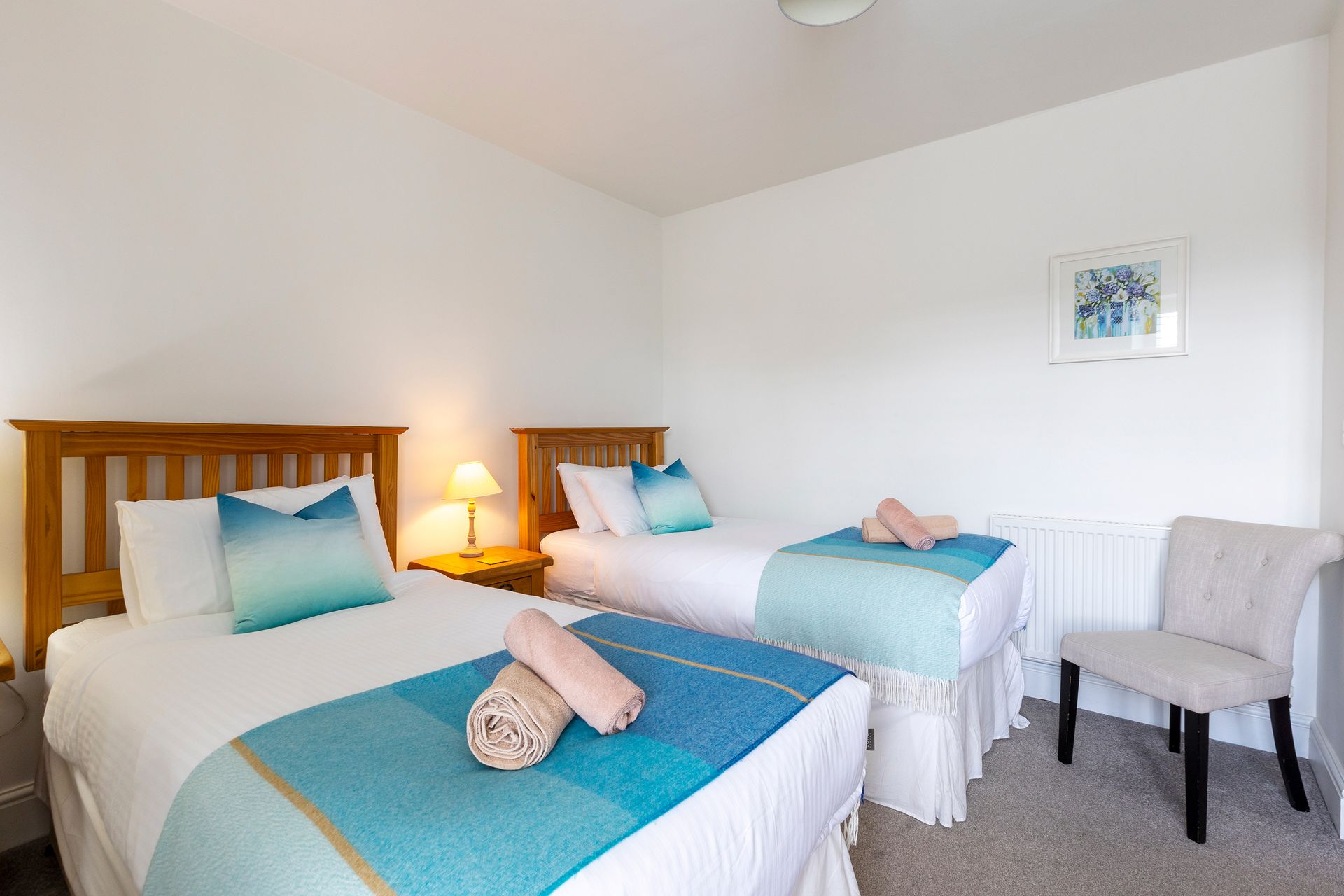 twin beds with blue throws