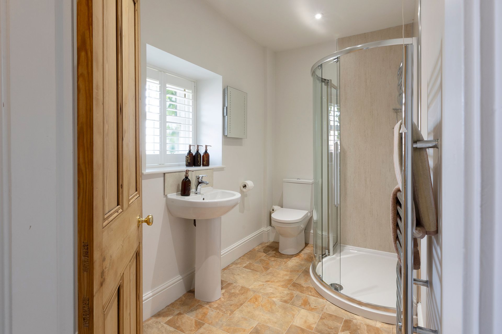 bathroom with original wooden door