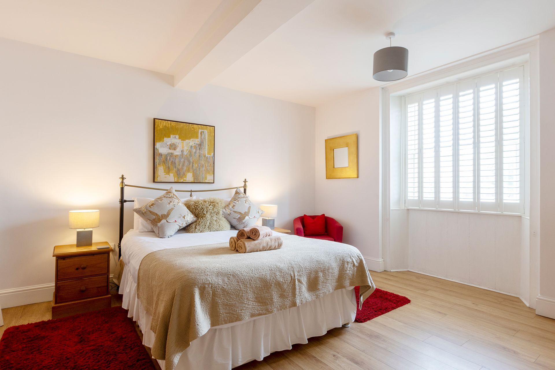 bedroom with king bed and large window