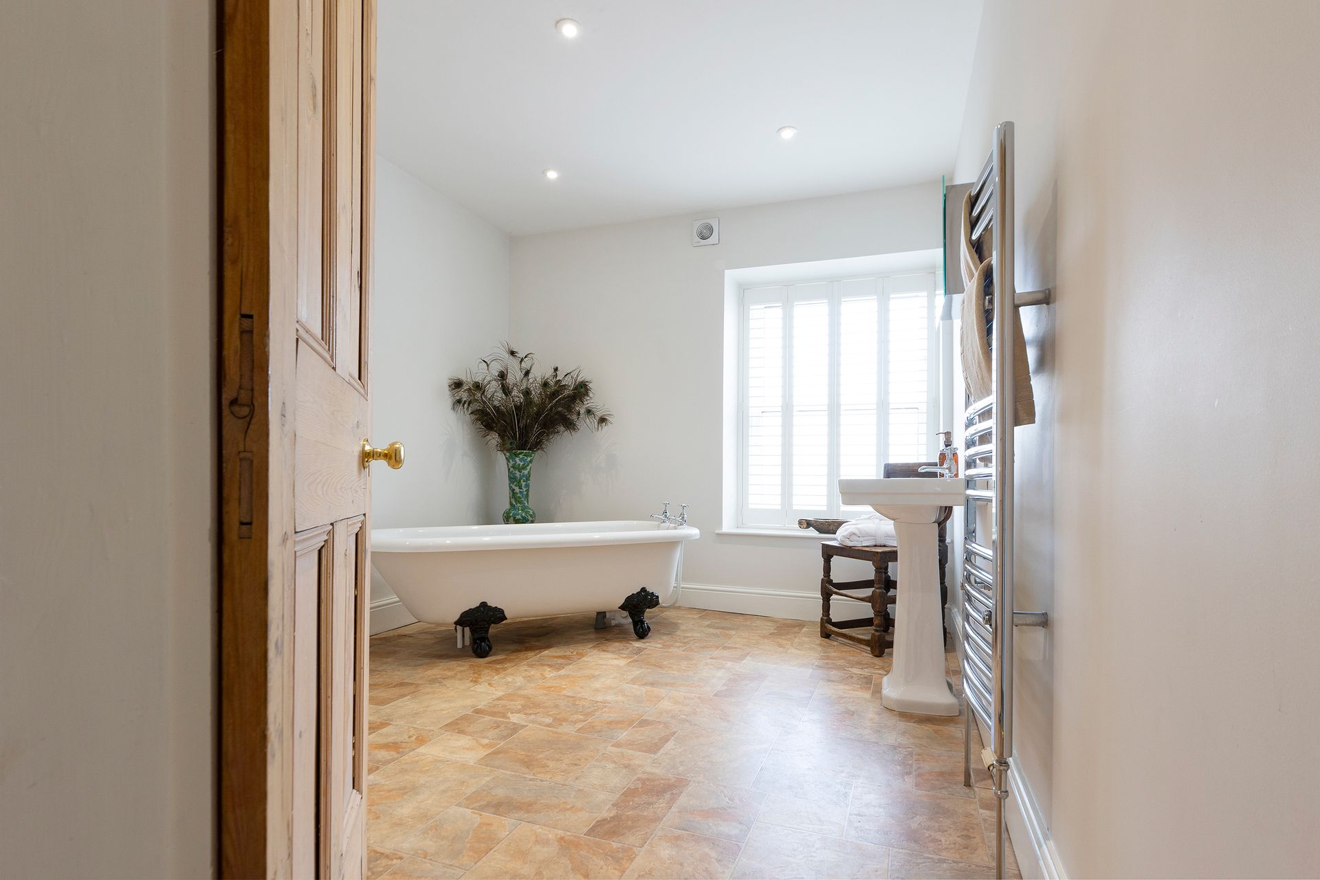 bathroom with roll top bath