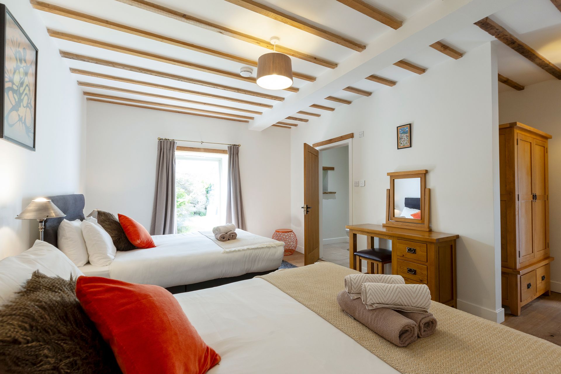 2 king beds with exposed beam ceiling