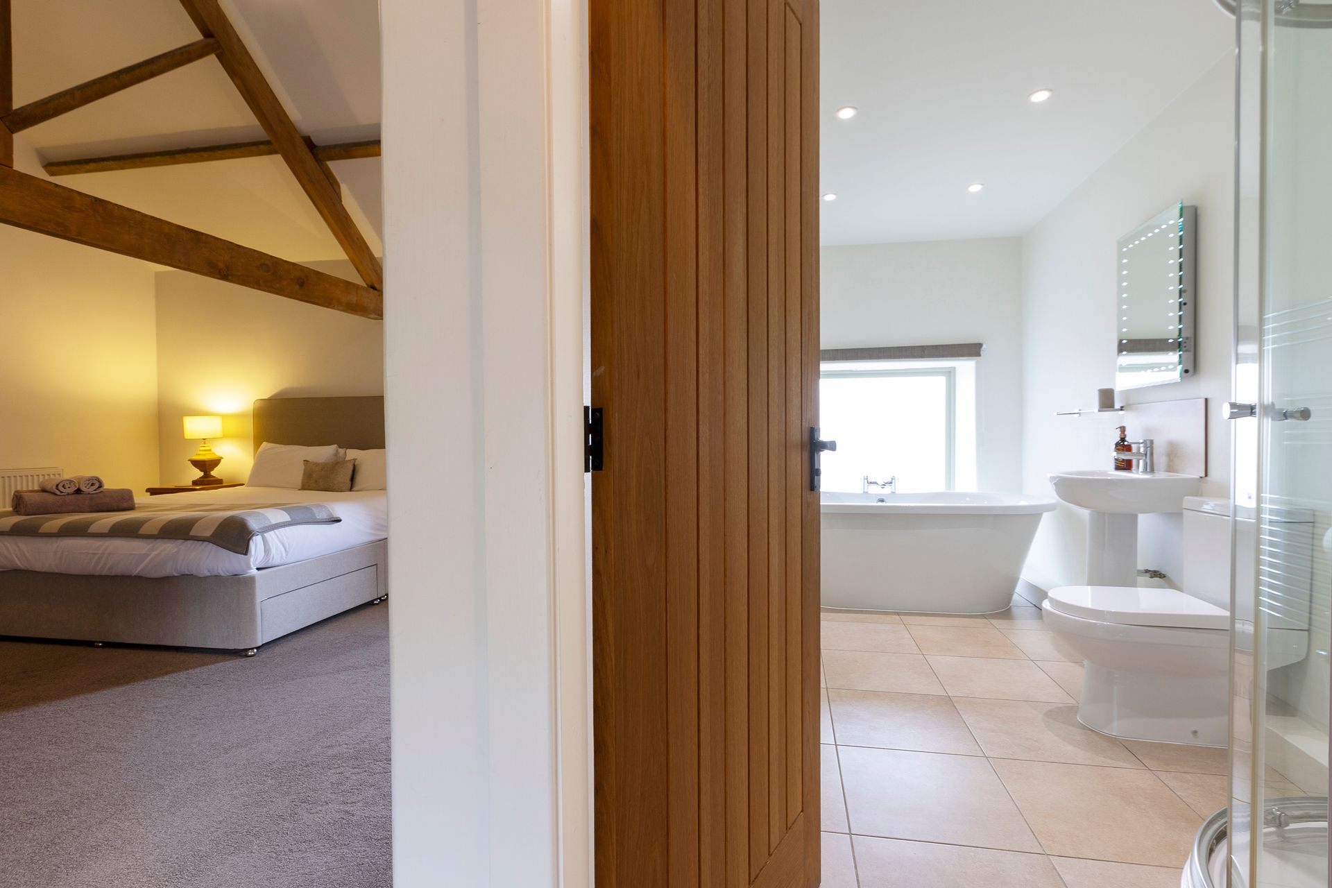 bedroom and ensuite with free standing bath