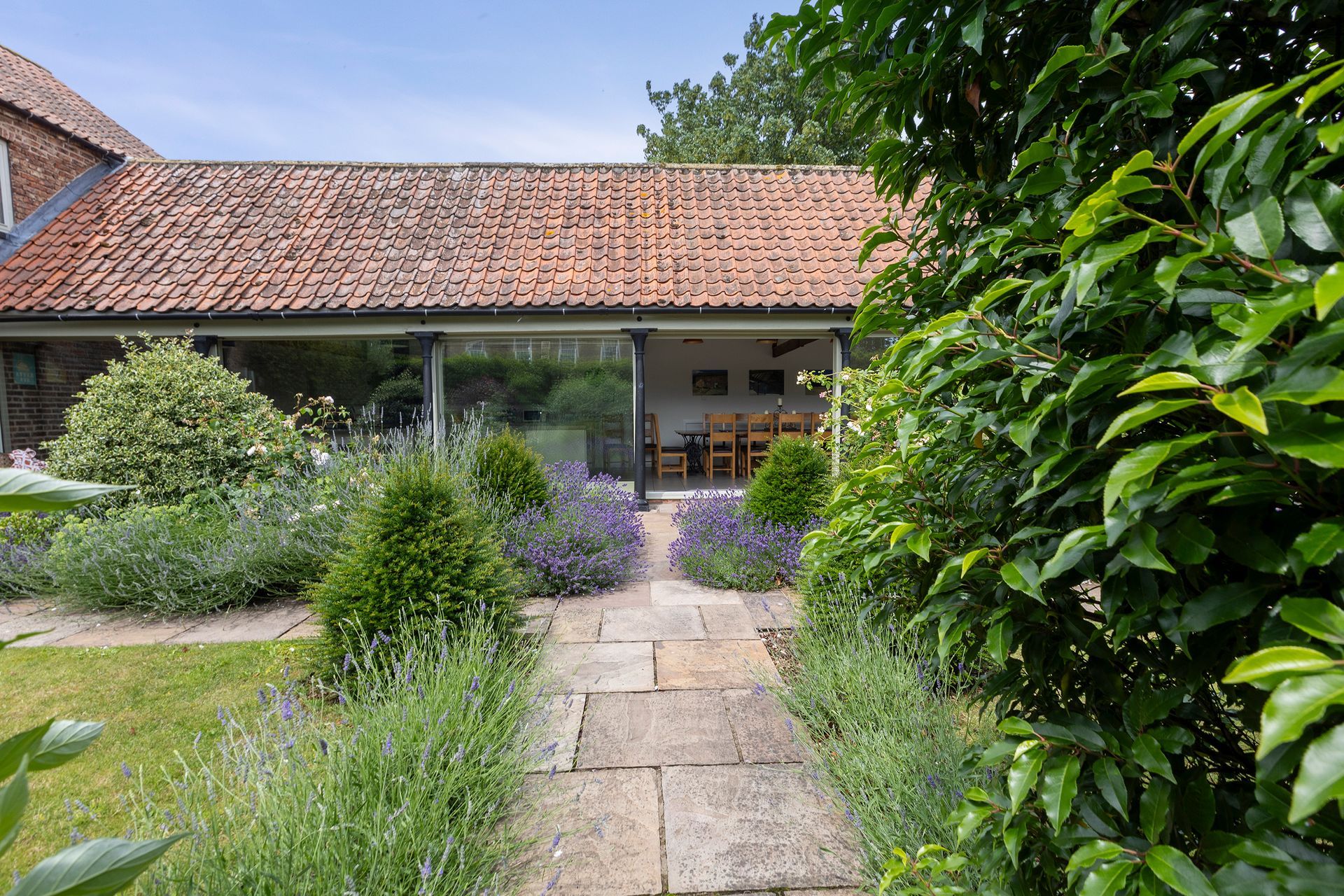 glazed building with garden and patio