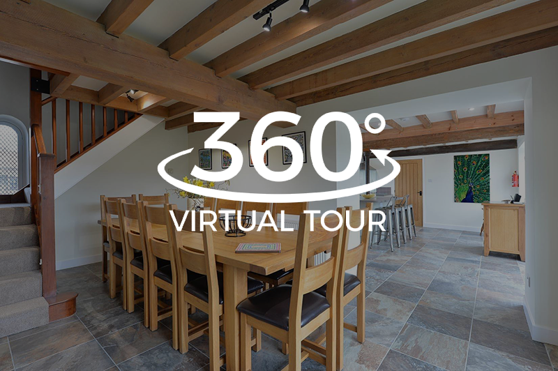 A 360 degree virtual tour of a dining room with a table and chairs.