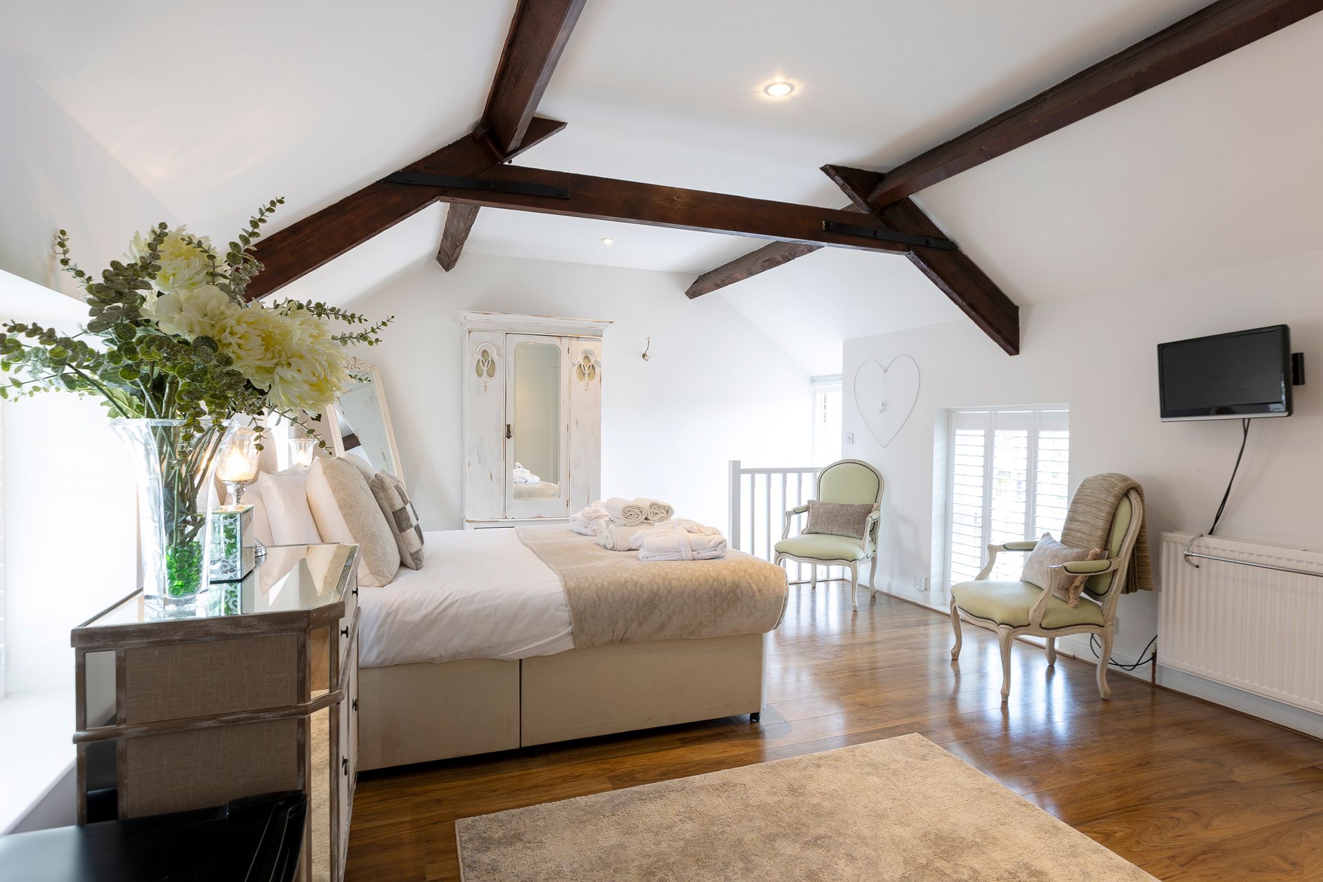 King bed and exposed beams