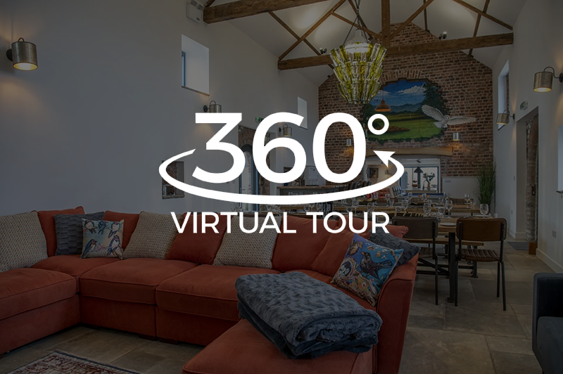 A 360 degree virtual tour of a living room with a red sectional couch.