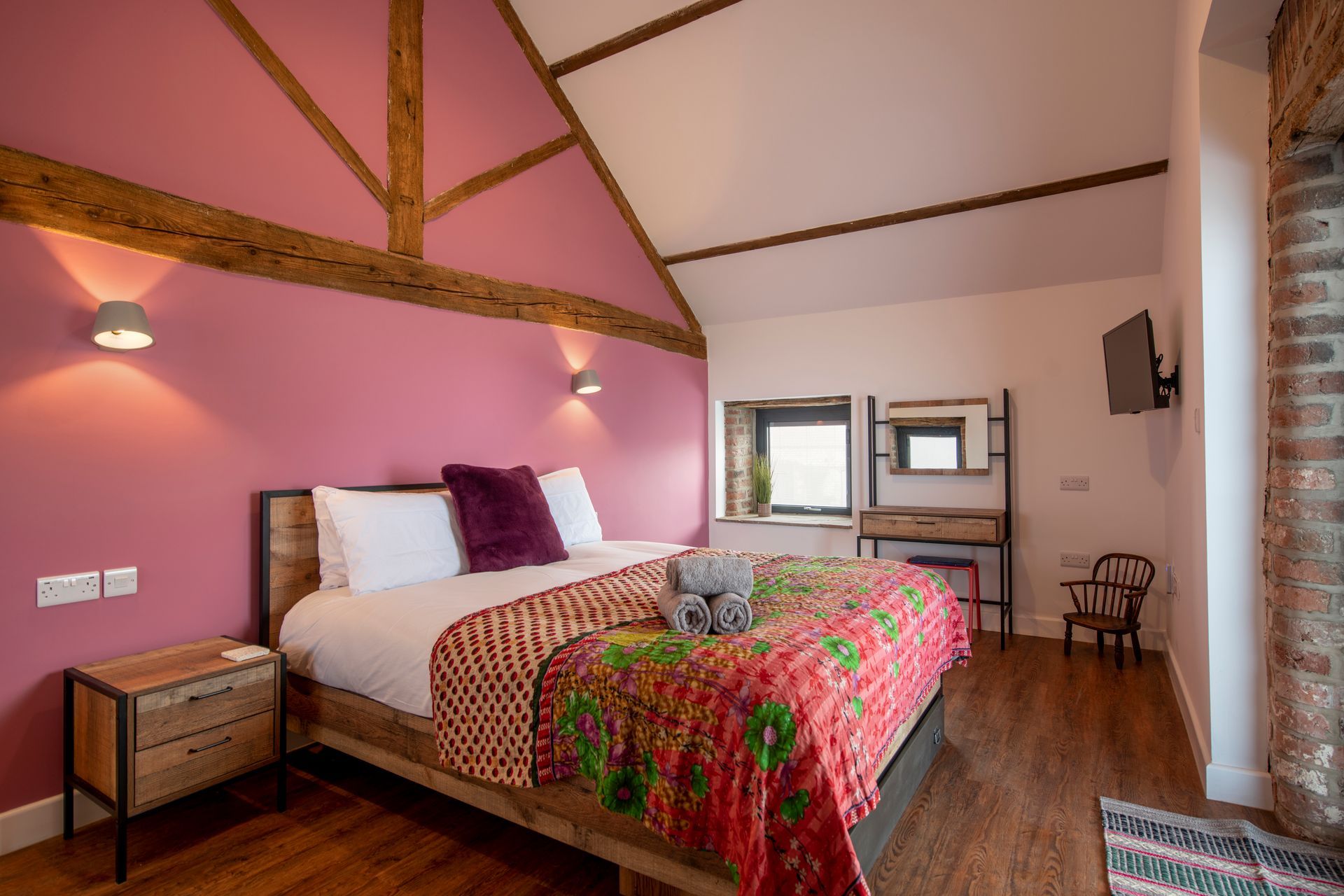 King bedroom with exposed beams