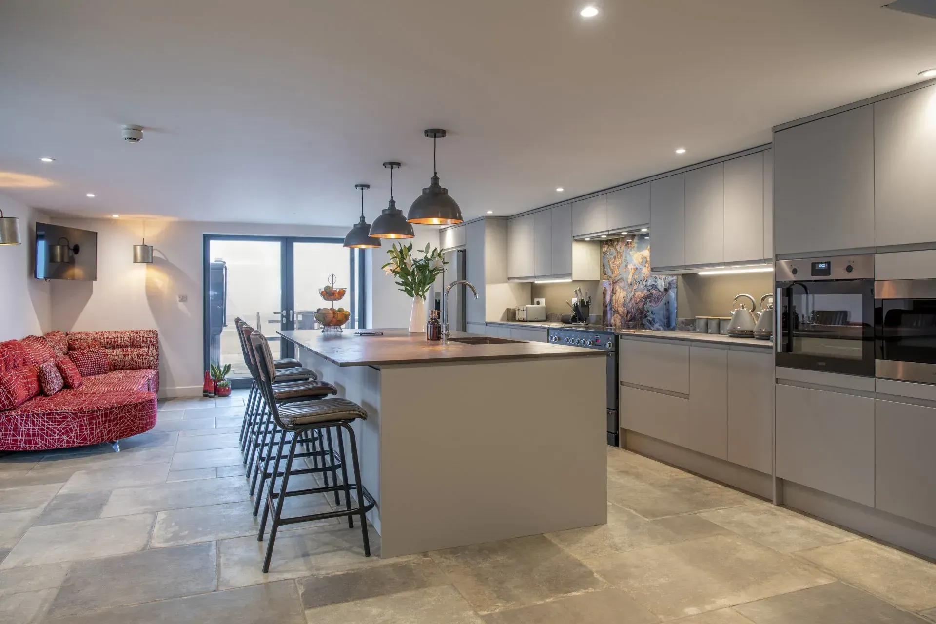 A large kitchen with a large island in the middle of the room.