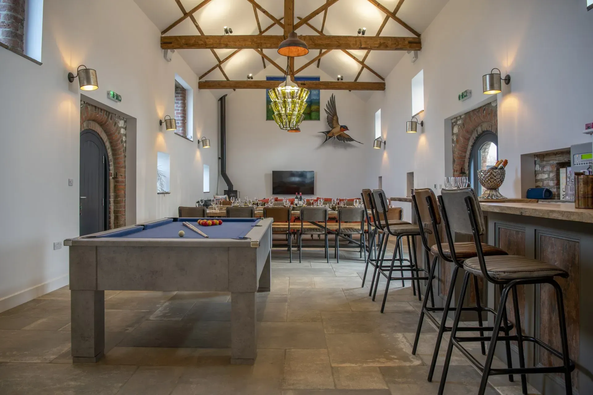 There is a pool table in the middle of the room.