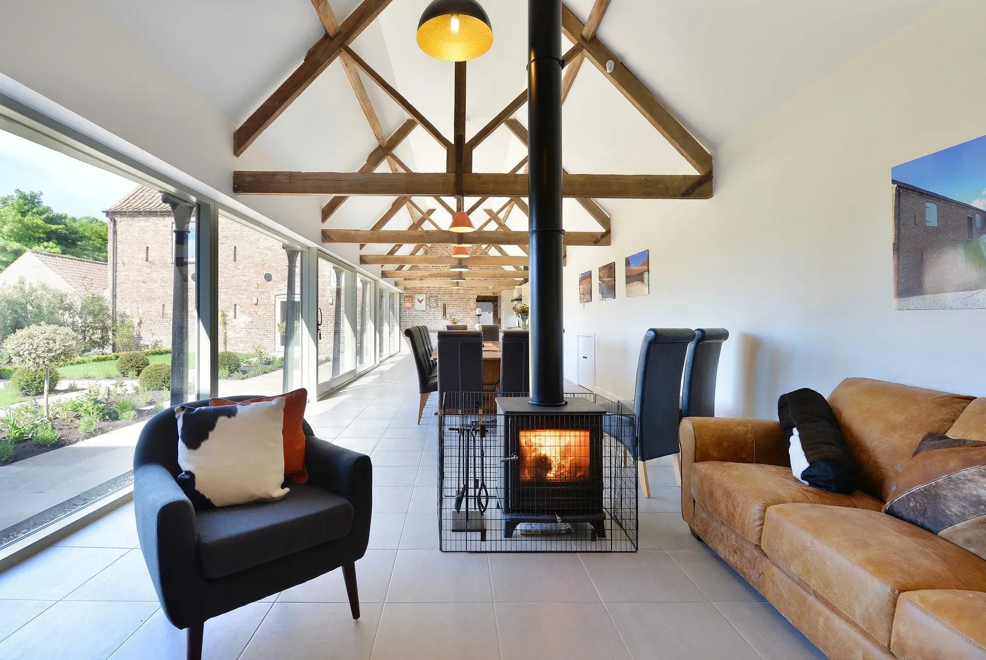 A living room with a couch a chair and a fireplace