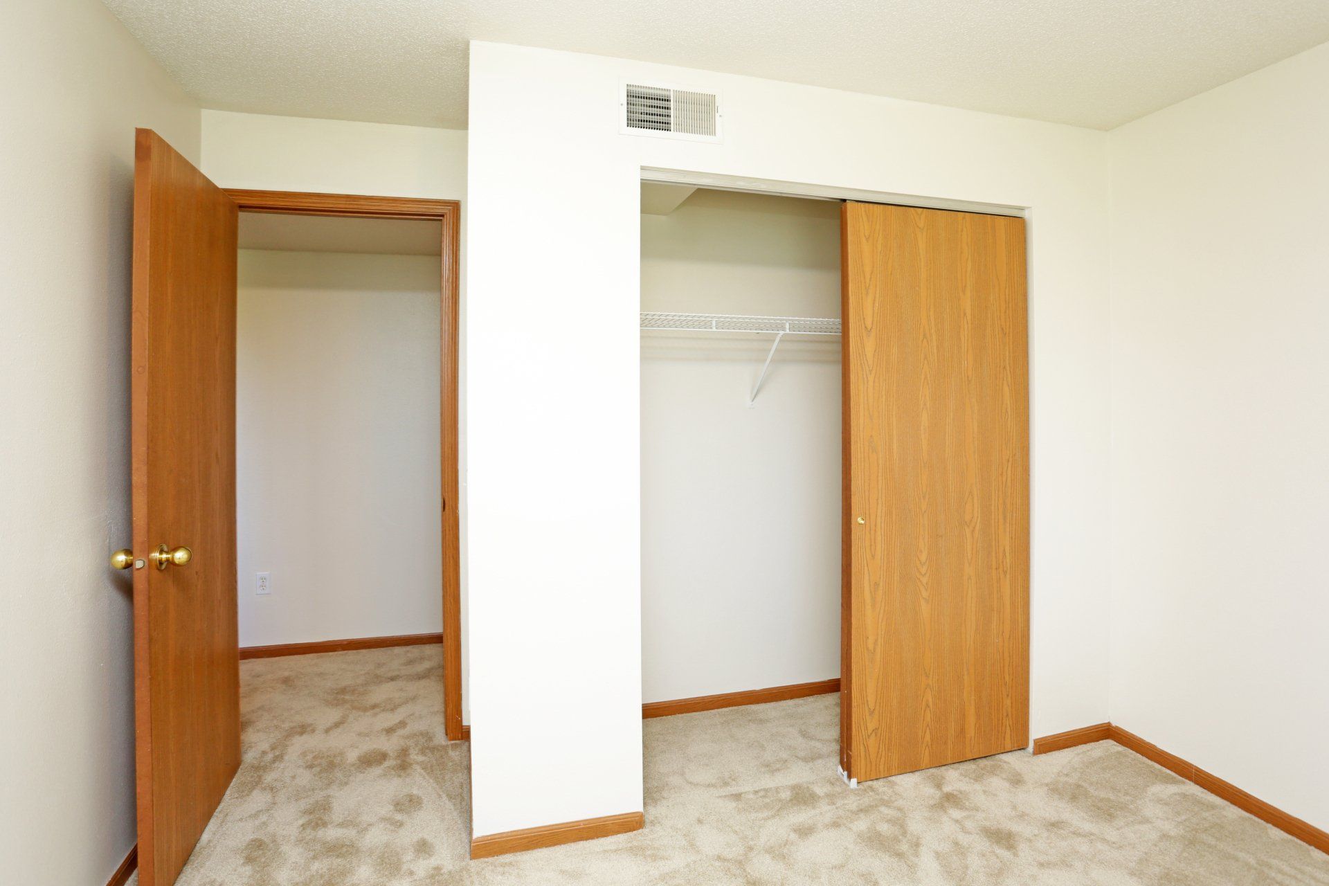Bedroom with entry to hallway and sliding closet door