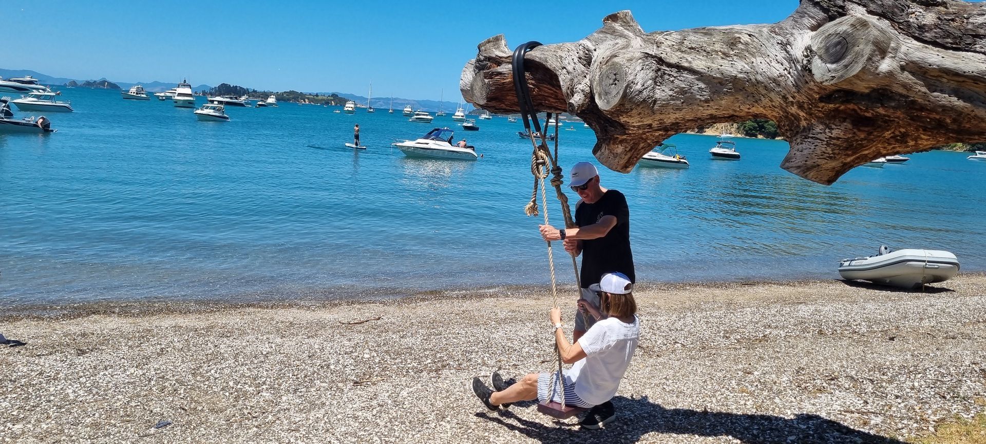 A couple on the swing at Man O' War Bay