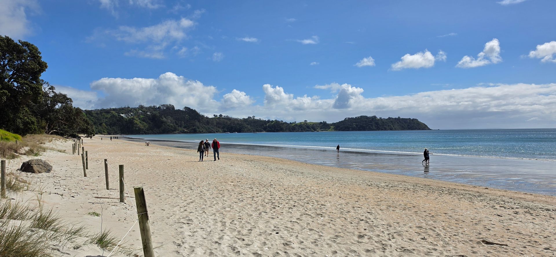 Walkers on Onetangi Beach, Waiheke Island
