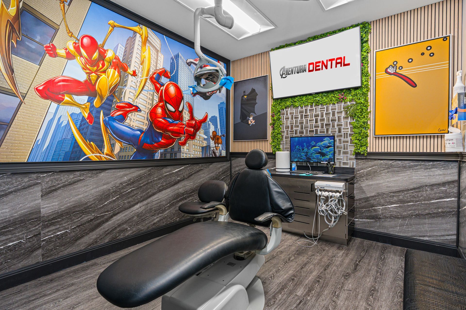 Modern dental clinic interior with chair, colorful wall art, and reception desk