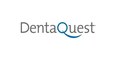 DentaQuest logo with gray text and a blue “Q” and curved underline on a white background