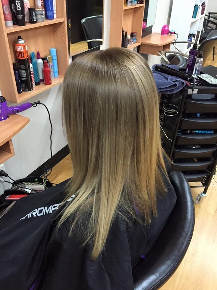 Woman with Straight, Light Brown Hair at A Salon — EDISON Hair Collective In Mackay, QLD
