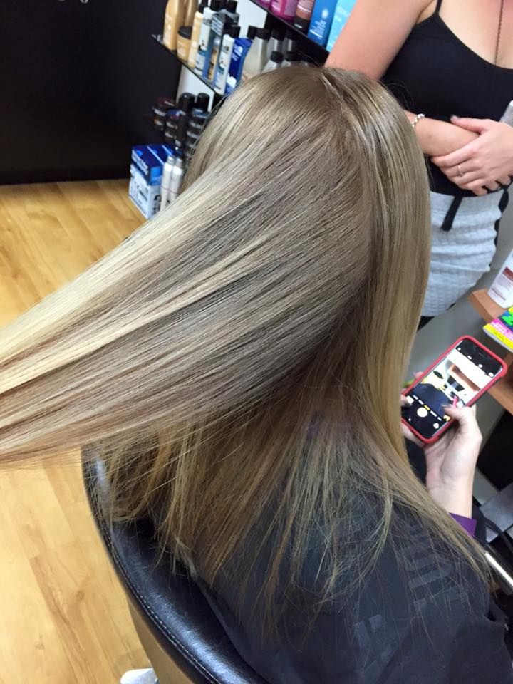 Woman's Hair, a Light Brown Colour, Being Styled in A Salon, Held by Stylist — EDISON Hair Collective In Mackay, QLD