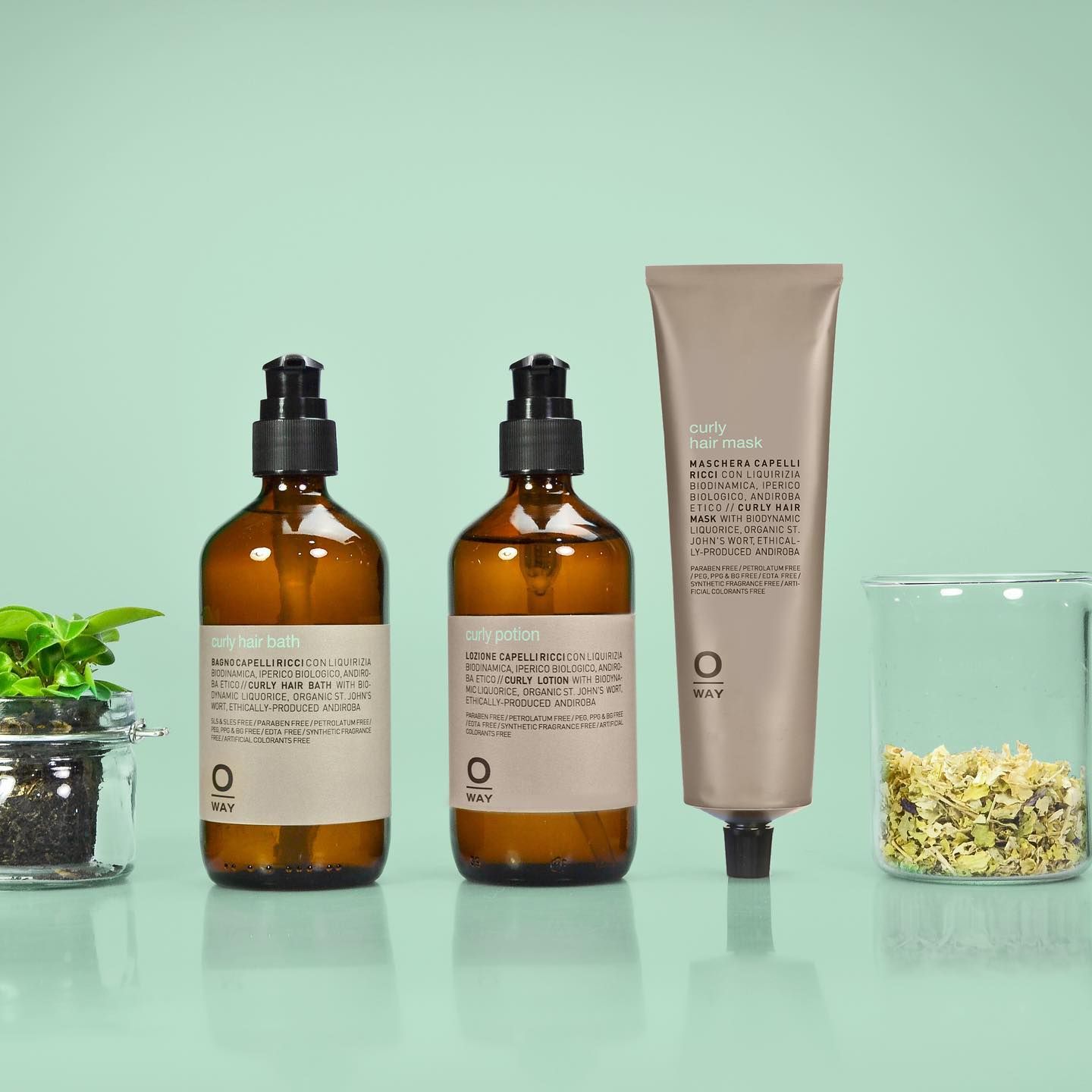 Bottles of Brown Liquid With Pump Tops, a Tube of Skincare  — EDISON Hair Collective In Mackay, QLD