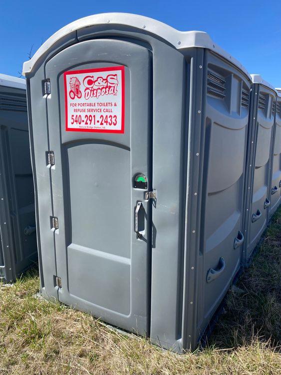Blue Garbage Dumpster Full of Waste — Station, VA — C & S Disposal Blue Garbage Dumpster Full of Waste — Station, VA — C & S Disposal