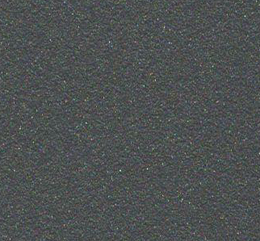 Superficie grigia scura con una texture statica e lievi macchie multicolori.