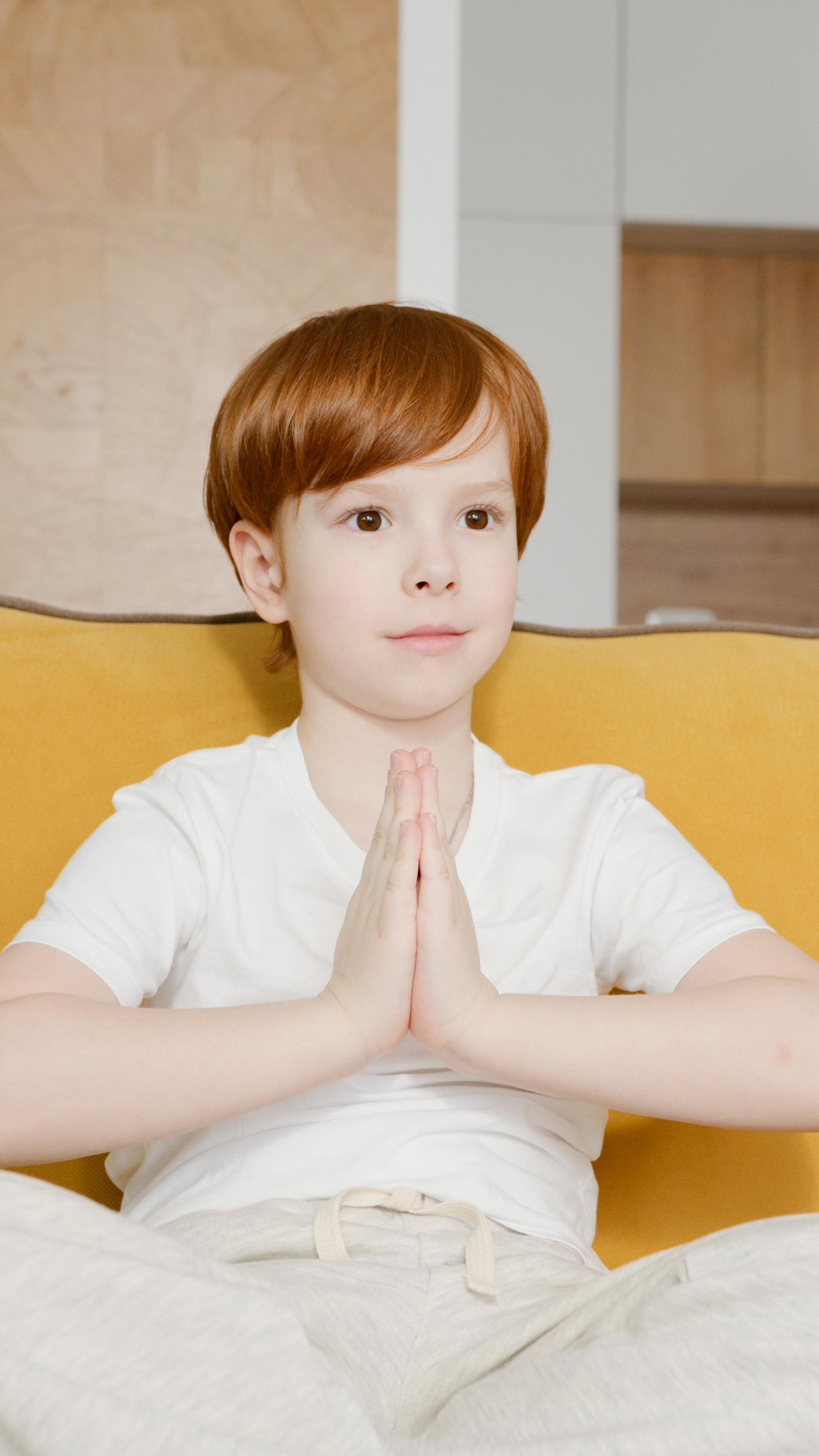 Boy practicing a yoga pose