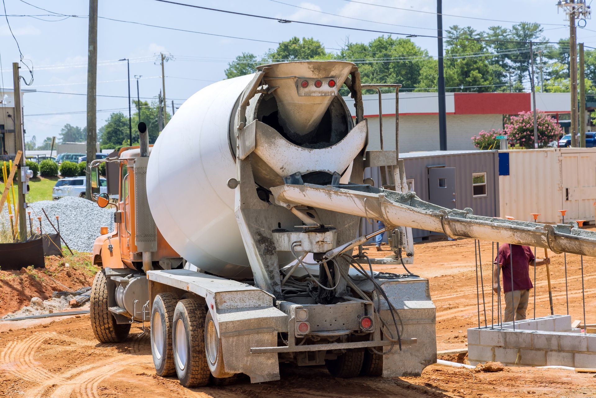 Ready-mix concrete delivery services in Olathe, KS, with a mixer truck delivering fresh concrete