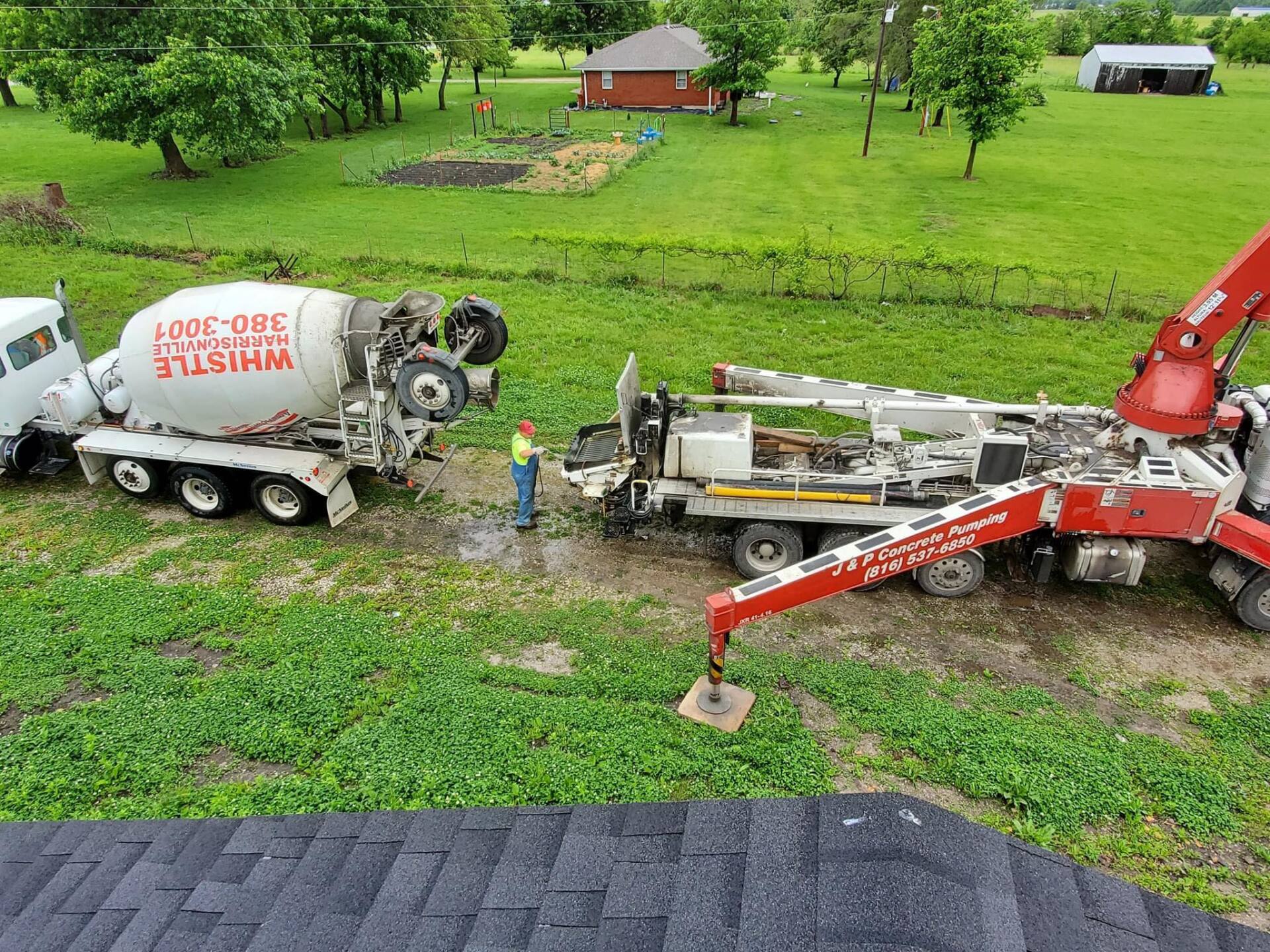 Worker Mixing Cement by Hand - Concrete Services in Pleasant Hill, MO A truck completing a ready-mixed concrete delivery to a property in Lee's Summit, MO
