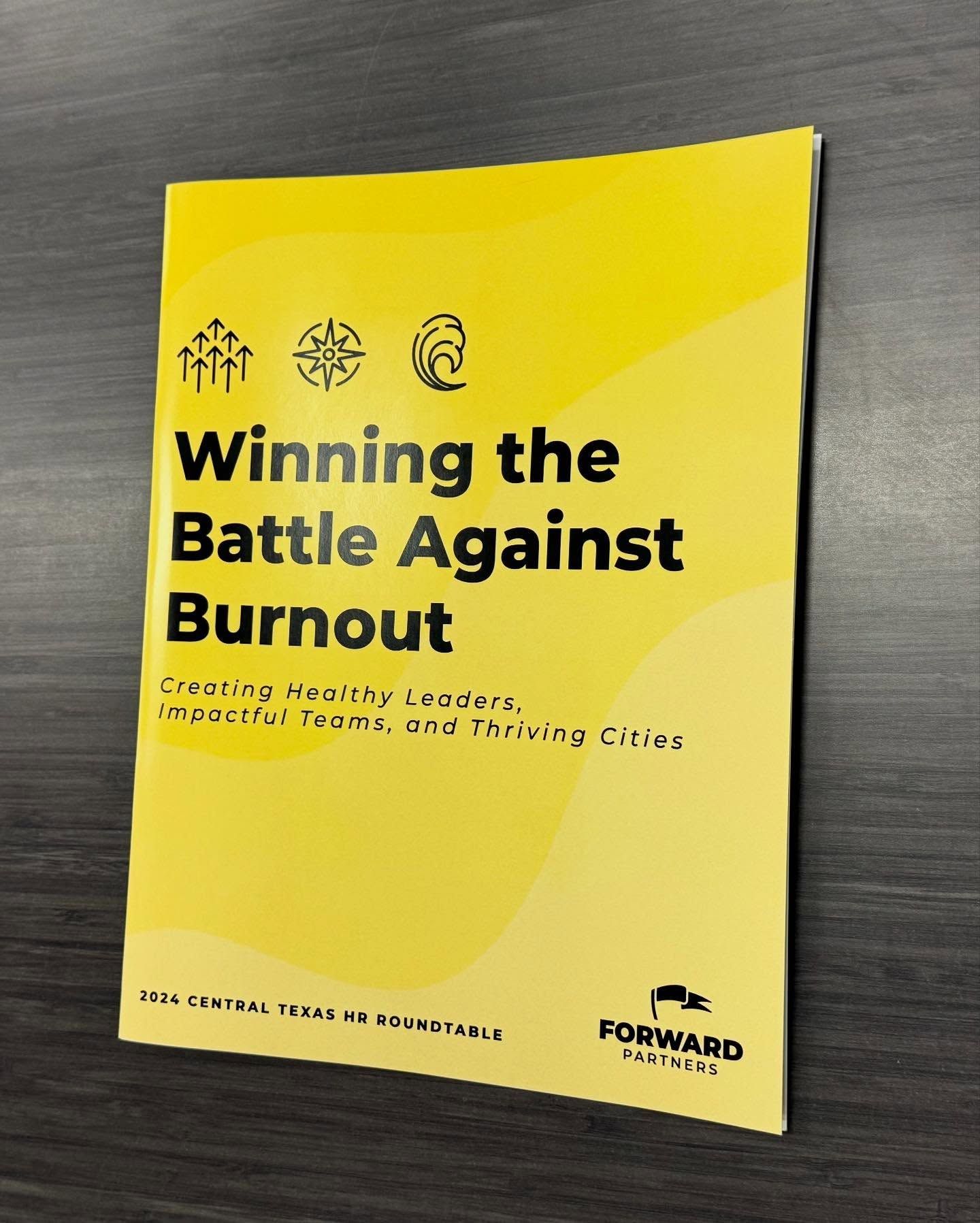 Yellow book cover titled “Winning the Battle Against Burnout” on a dark surface