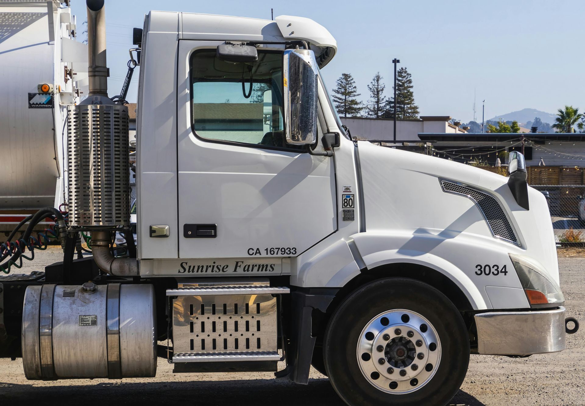 A white semi truck with the number 3004 on the side