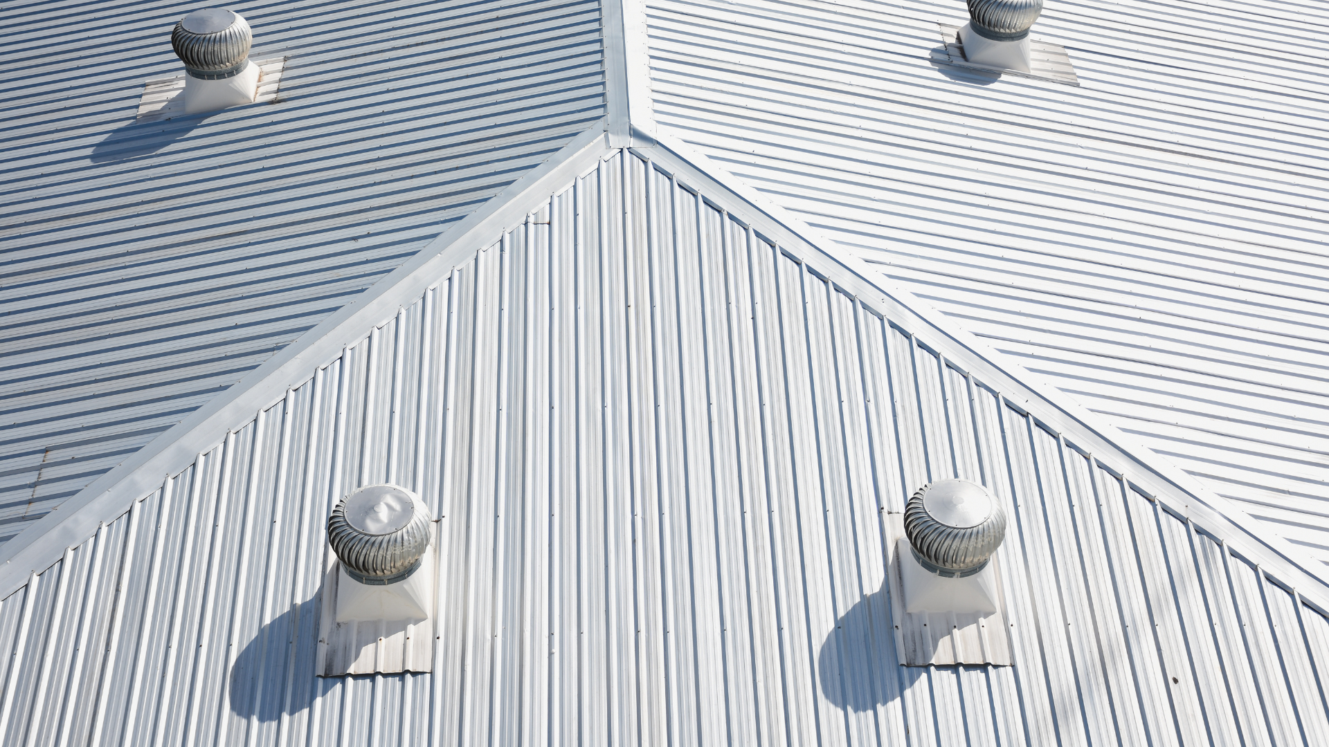a white roof with a lot of vents on it .