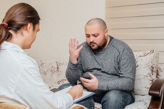 man talking to counselor