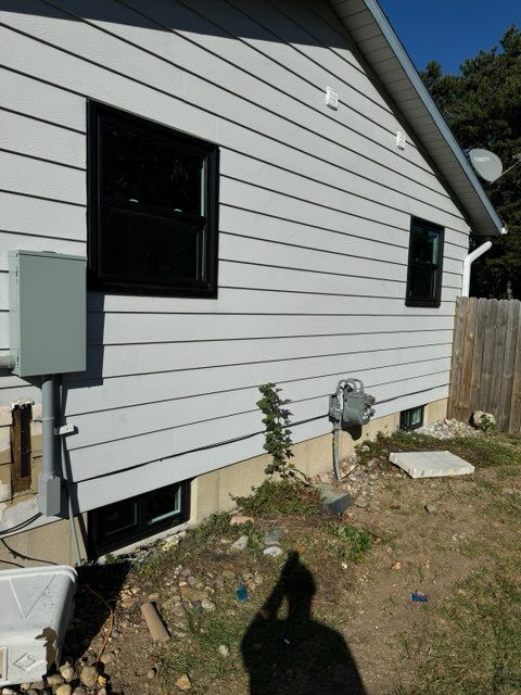 A house with a satellite dish on top of it