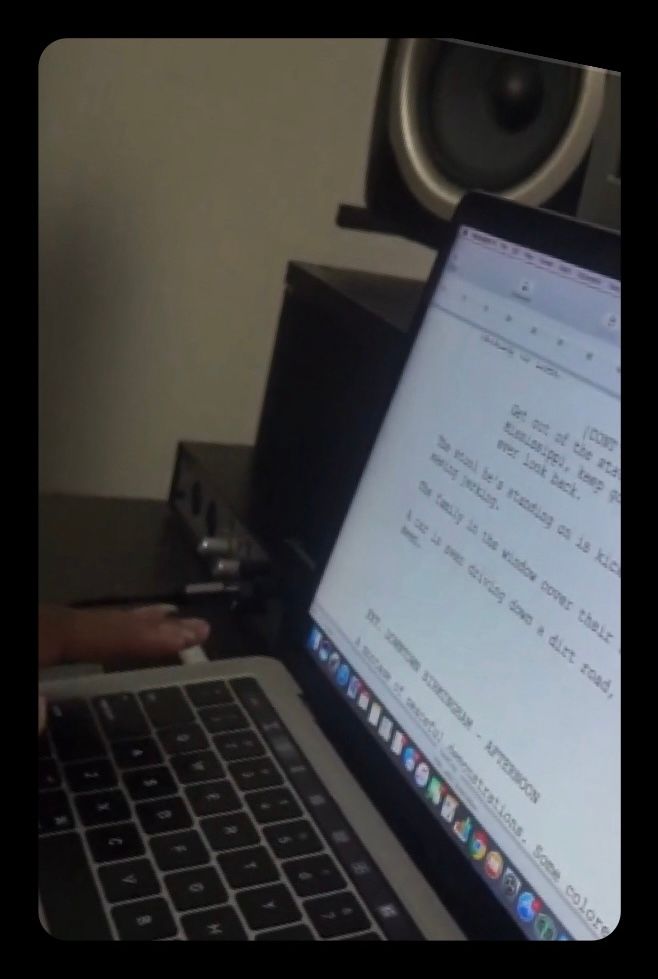 A person is typing on a laptop that says ' amanda ' on the screen
