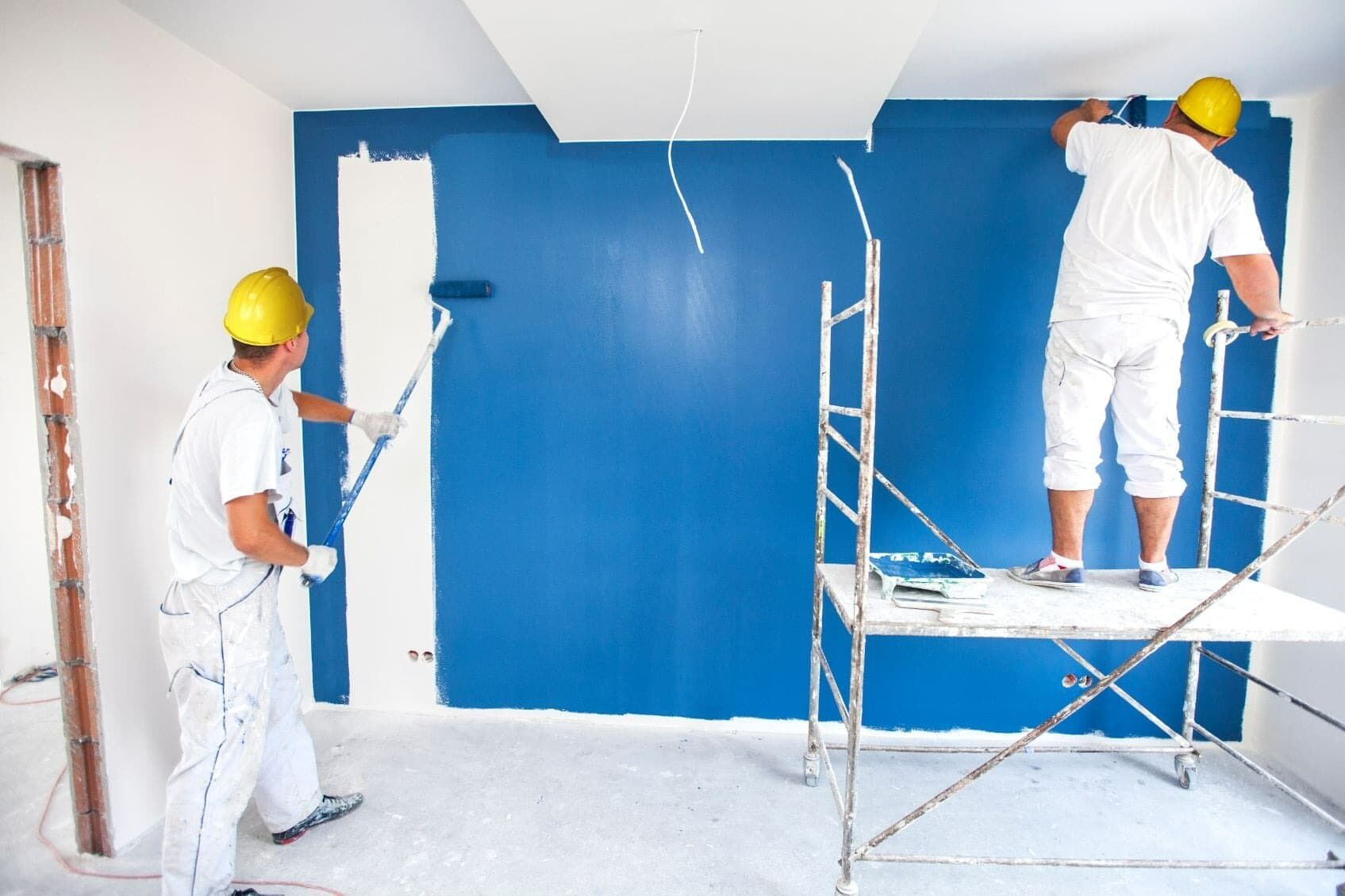 Two Men Painting Wall in a Blue Colour — Painters in Mackay