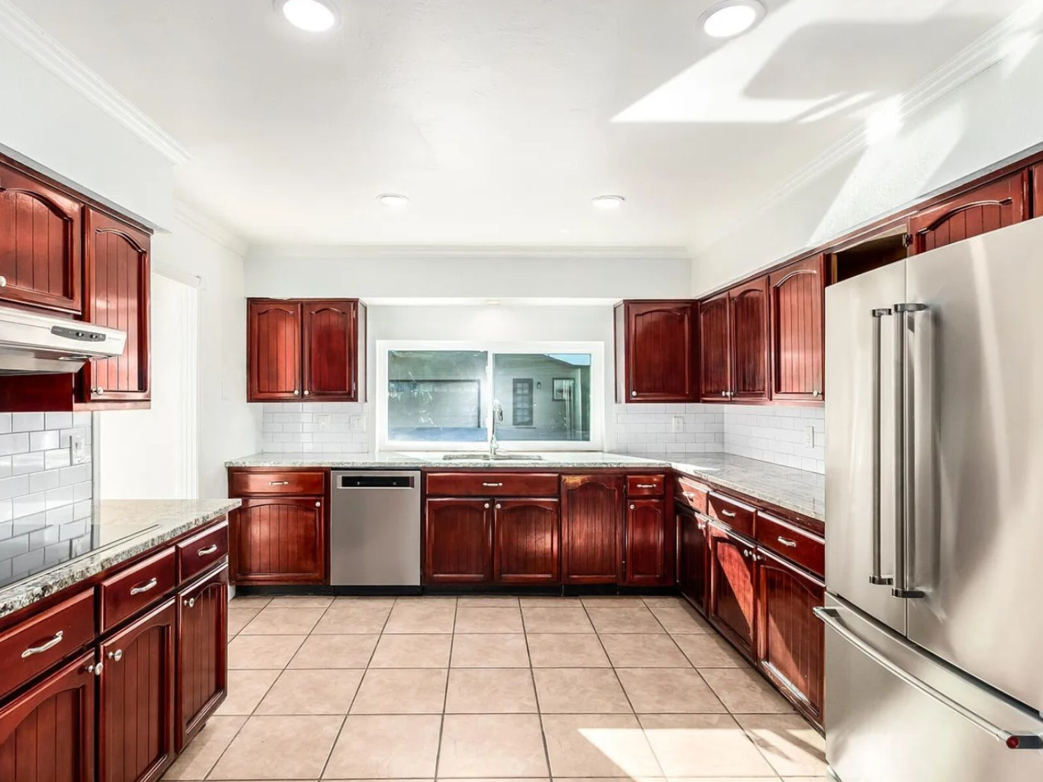 Renovated kitchen with stainless steel appliances at a Bedroom For Rent home in Phoenix, AZ