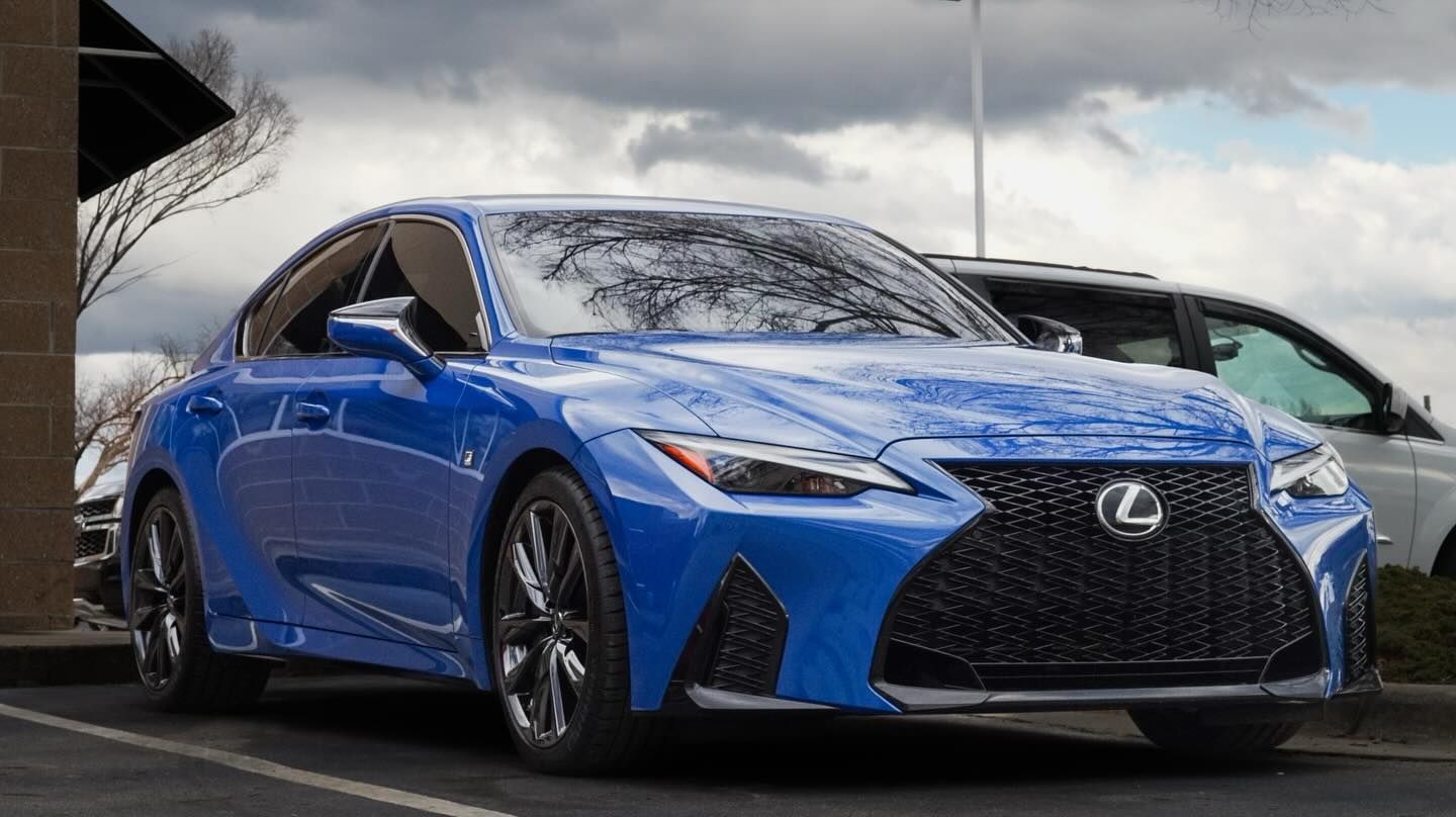 Blue Lexus sports car parked outdoors.