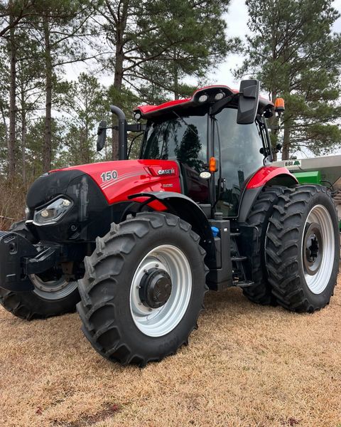 Red Case IH tractor parked outside.
