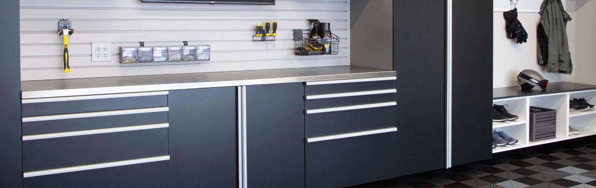 A garage with a grey cabinets