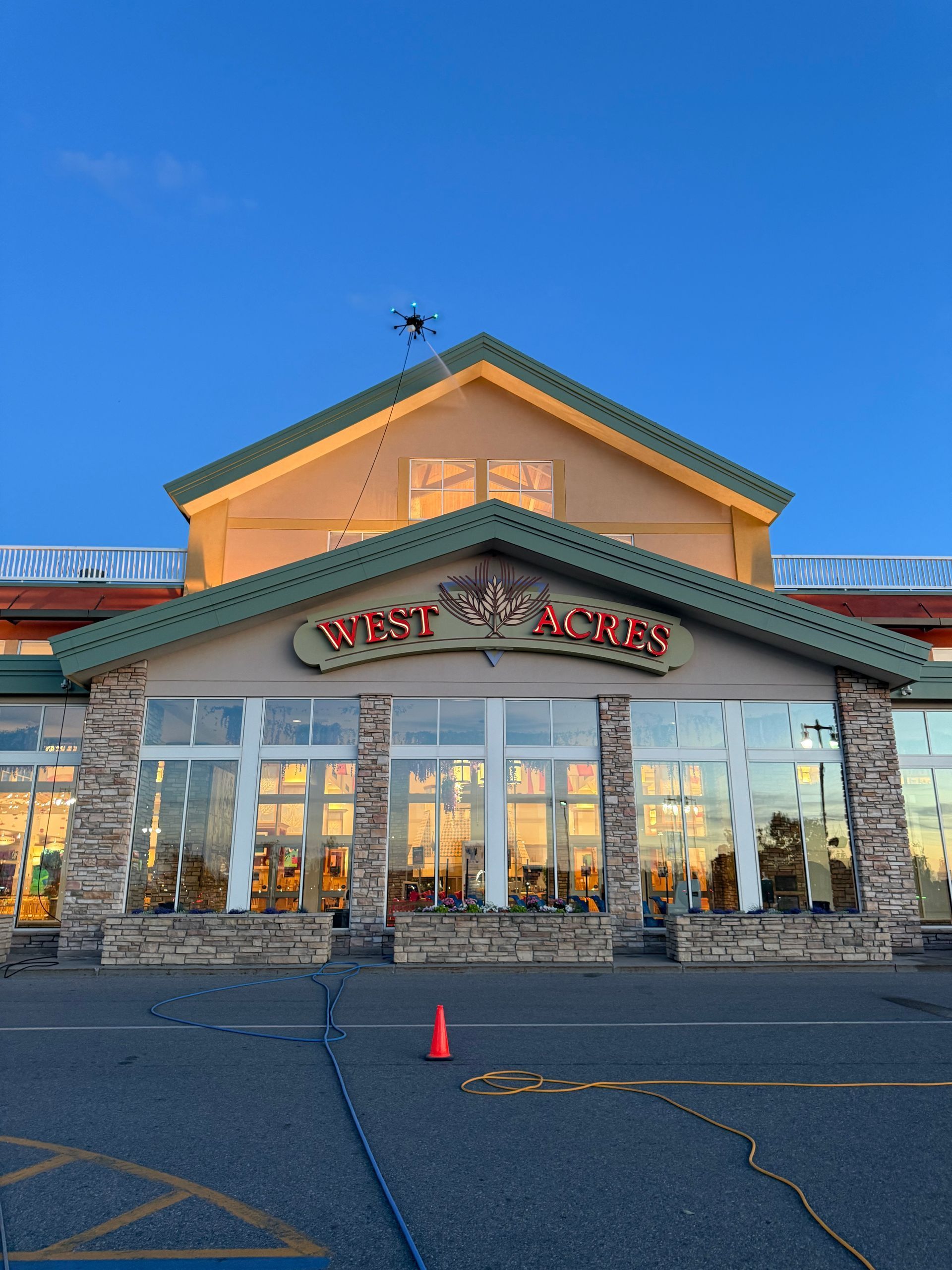 Target storefront at dusk with large glass windows and stone base