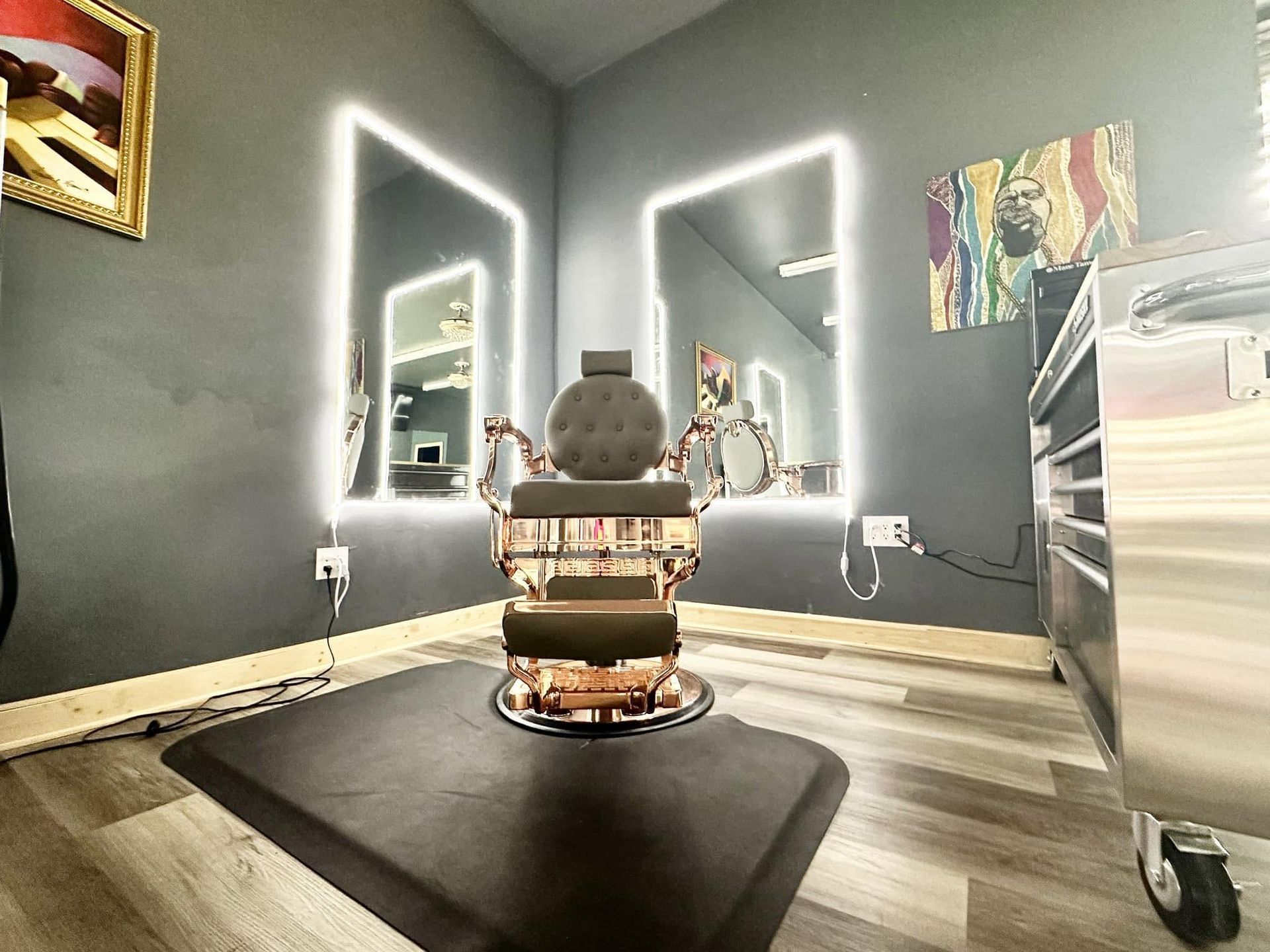 Stylish barber chair in a modern salon with illuminated mirrors and dark walls