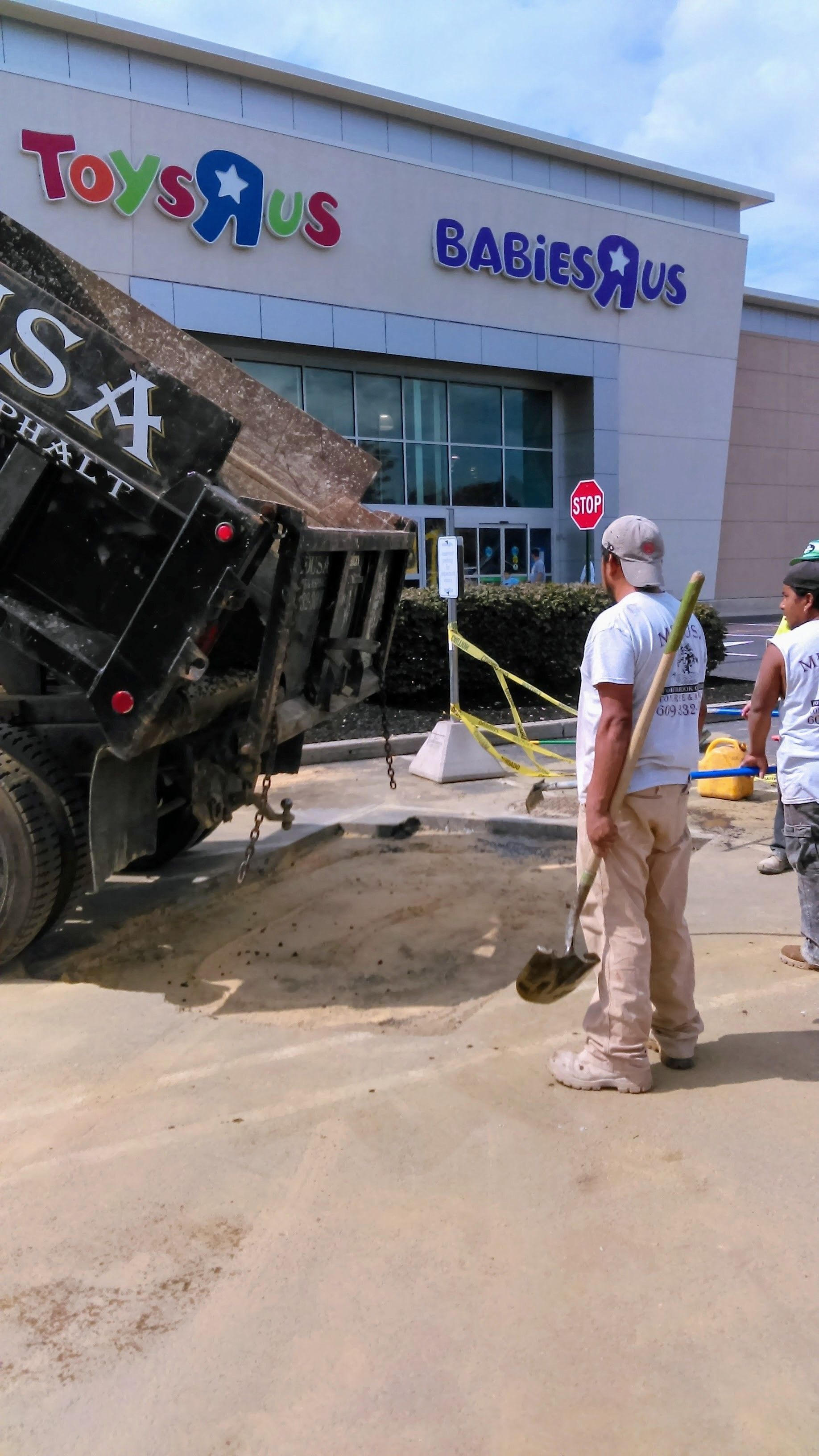 Construction workers near a Toys