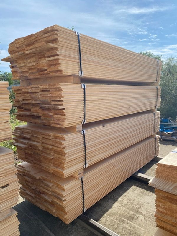 A pile of wood is stacked on top of each other.