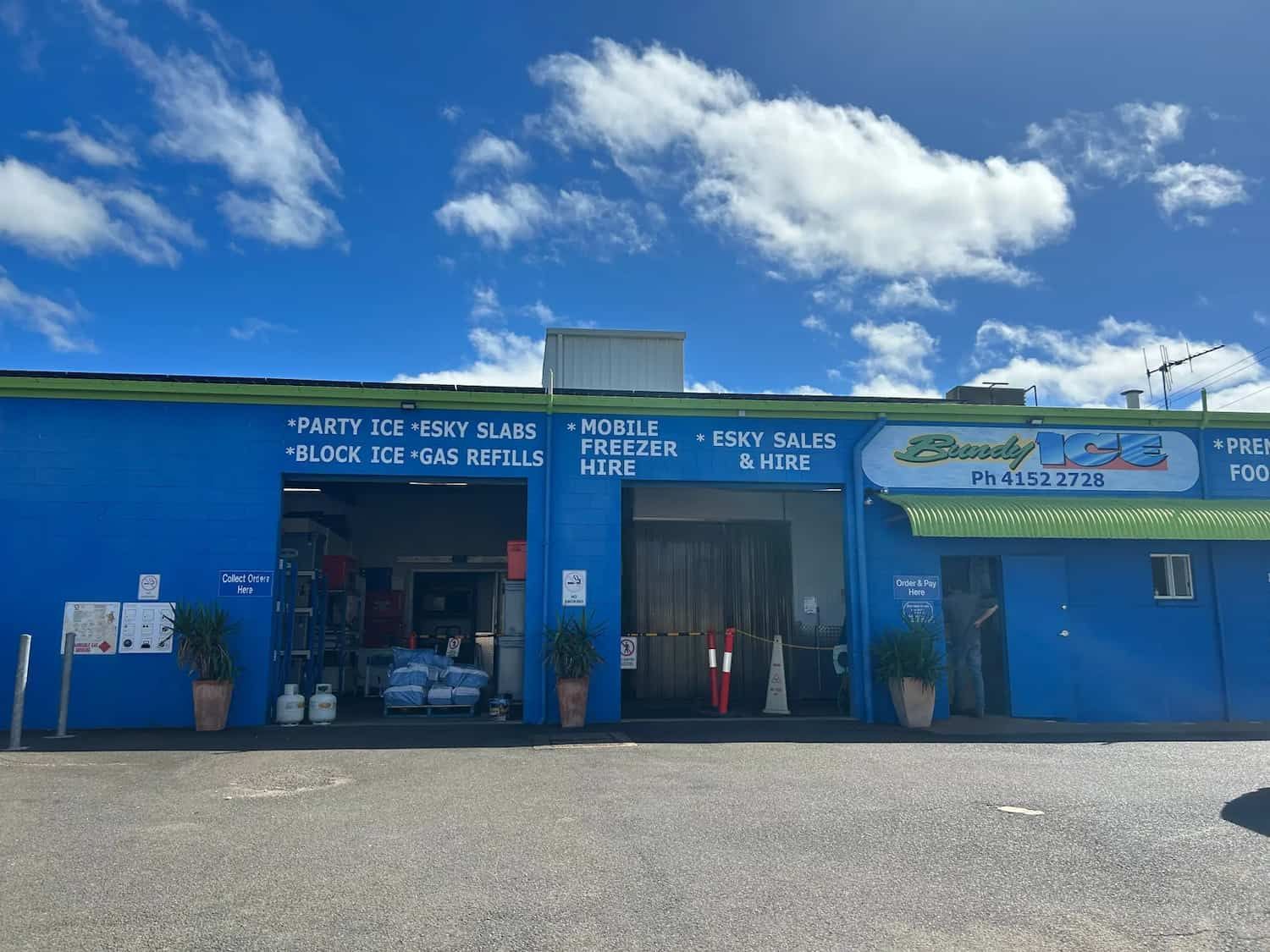 A Blue and Green Building With a Sign That Says Bundy Ice — Bundy Ice in Bundaberg East, QLD