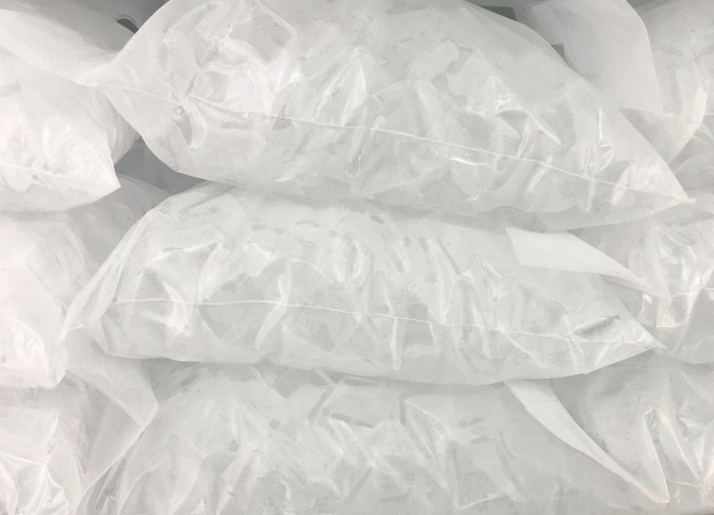 A Pile of White Plastic Bags Stacked on Top of Each Other — Bundy Ice in Gladstone, QLD